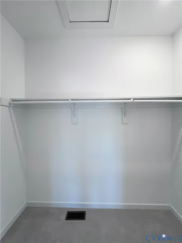 a bathroom with a granite countertop sink a toilet and a mirror