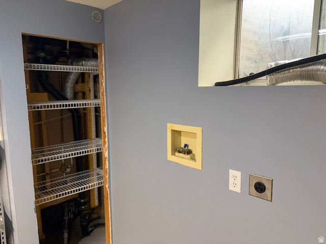 2313 150 East Bountiful, UT 84010 - Photo 34 of 39 Utility area featuring a laundry hookup, electrical outlets, and a storage alcove with wire shelving