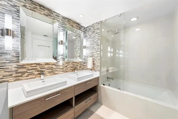 a bathroom with a bathtub and a sink