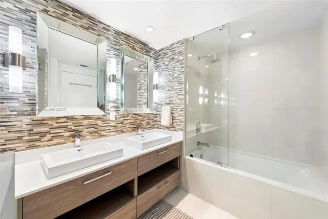 a bathroom with a bathtub and a sink