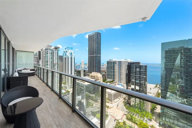 a view of balcony with furniture