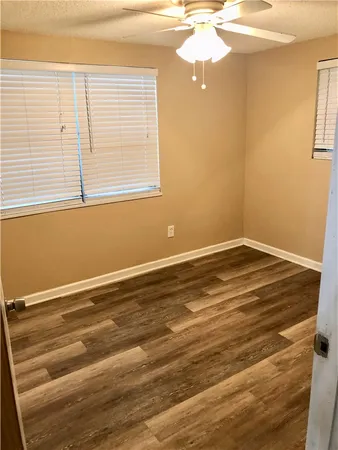 a view of a room with window and wooden floor