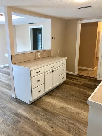 a bathroom with a sink and mirror