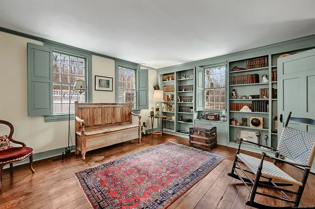 a living room with furniture and a rug