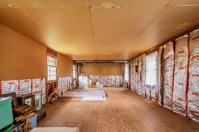a view of an empty room with stairs
