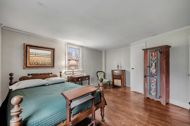 a living room with furniture a window and a table