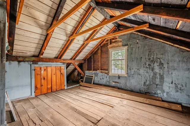 a front view of a house with parking area