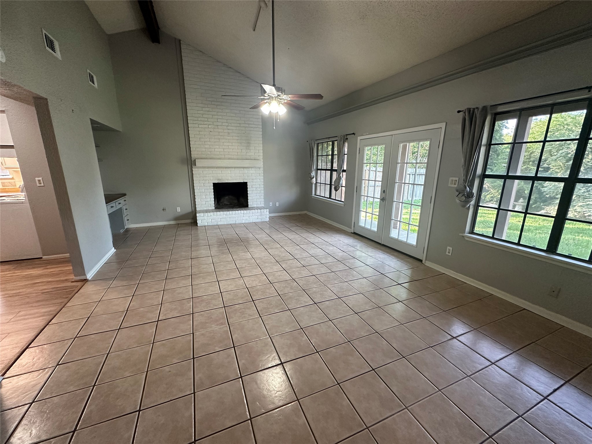 10813 Scenic Drive Montgomery, TX 77356 - Photo 2 of 10 a view of an empty room with a fireplace and a window