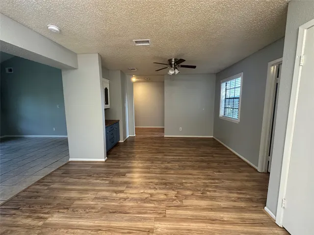 a view of an empty room and window