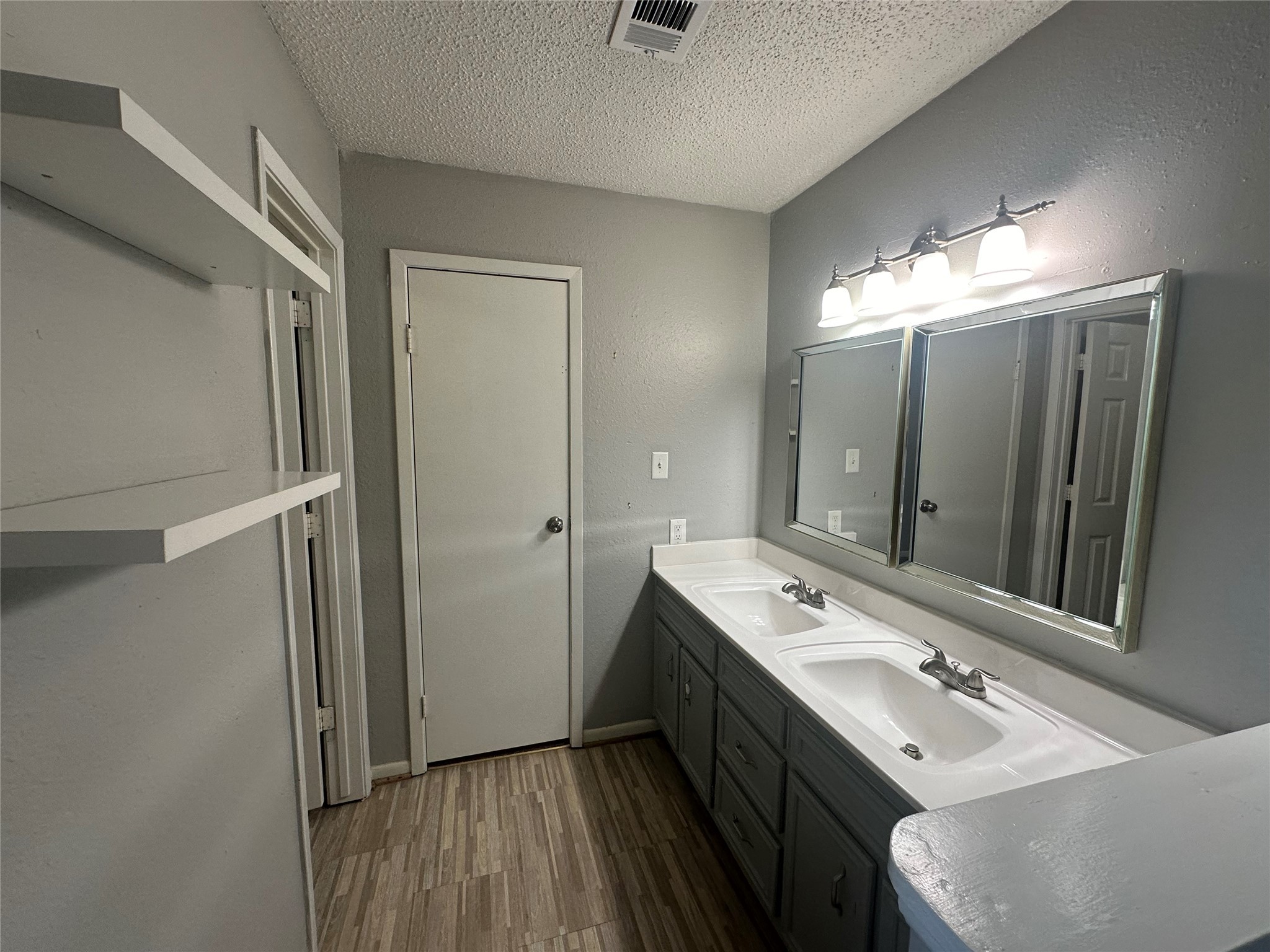 10813 Scenic Drive Montgomery, TX 77356 - Photo 6 of 10 a bathroom with a double vanity sink and mirror