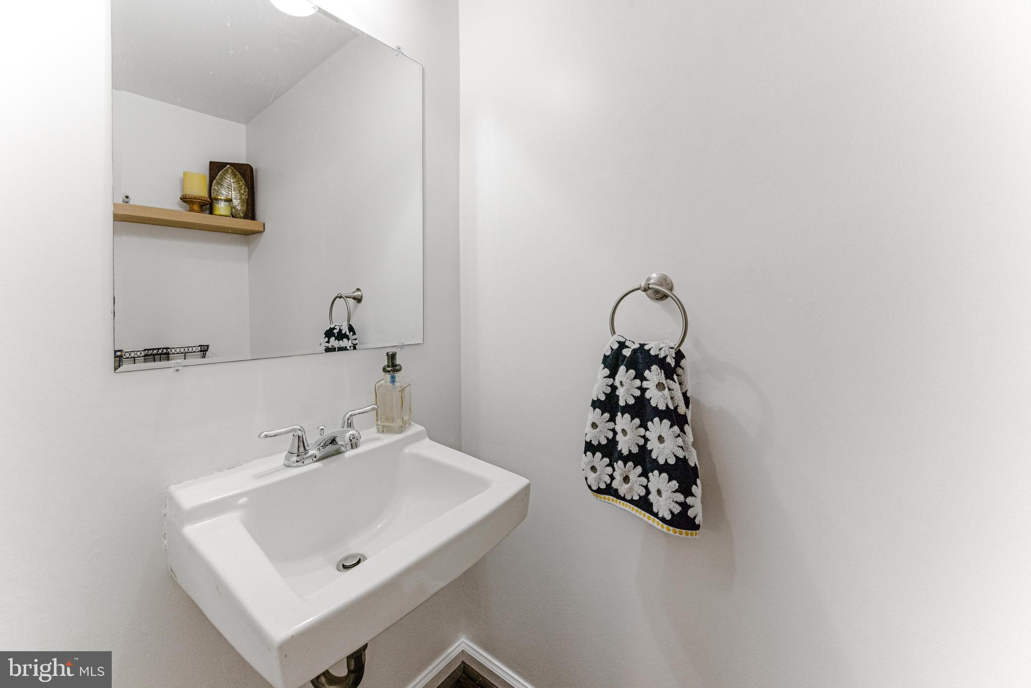 9023 Deviation Road Nottingham, MD 21236 - Photo 11 of 47 a bathroom with a sink and a mirror