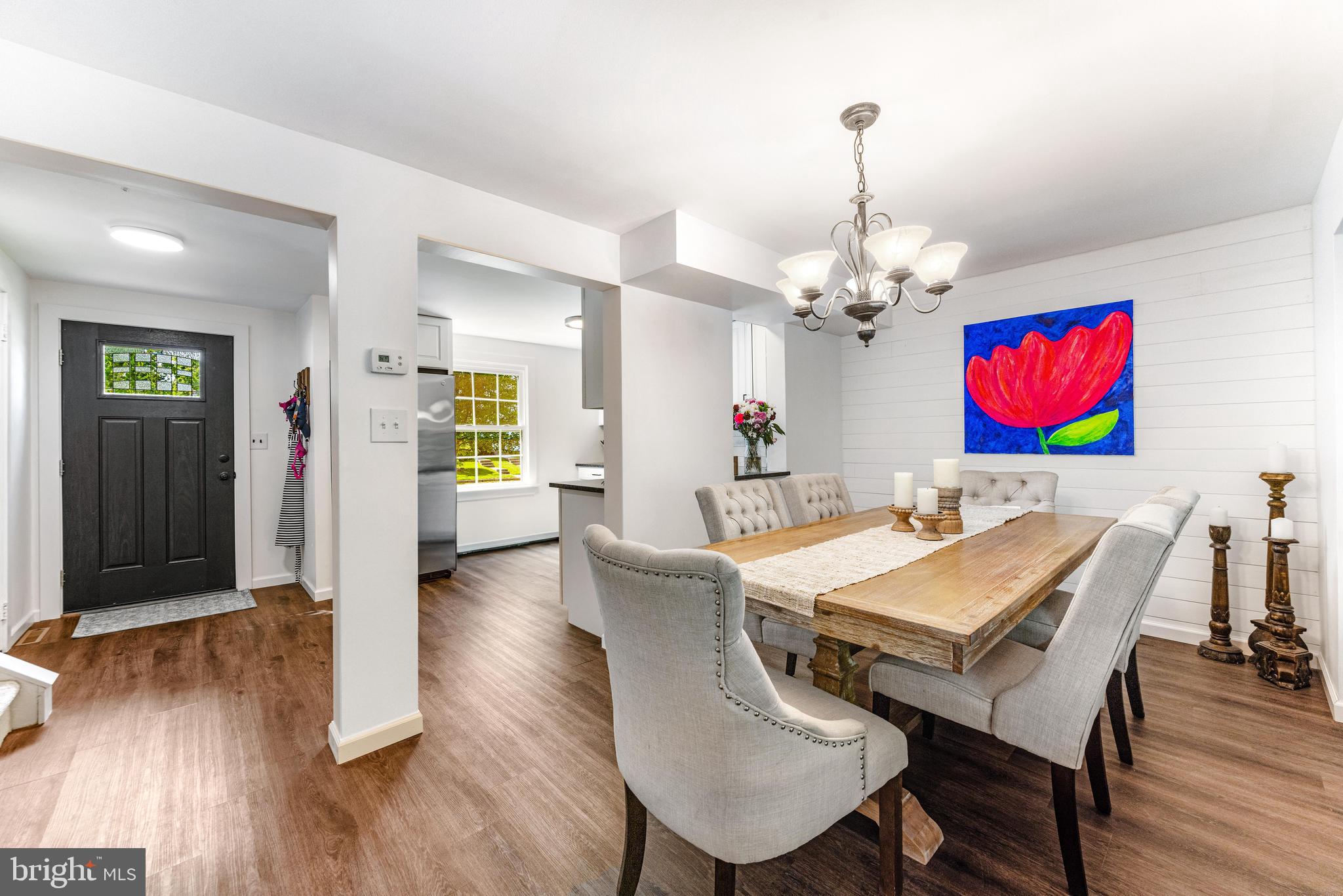 9023 Deviation Road Nottingham, MD 21236 - Photo 16 of 47 a view of a dining room with furniture wooden floor and chandelier