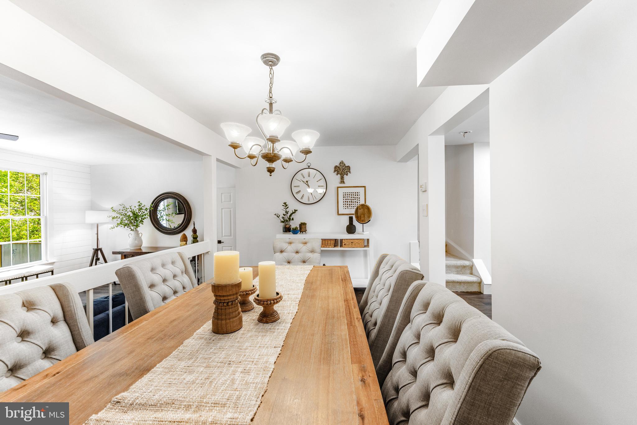 9023 Deviation Road Nottingham, MD 21236 - Photo 17 of 47 a living room with furniture chandelier and a mirror