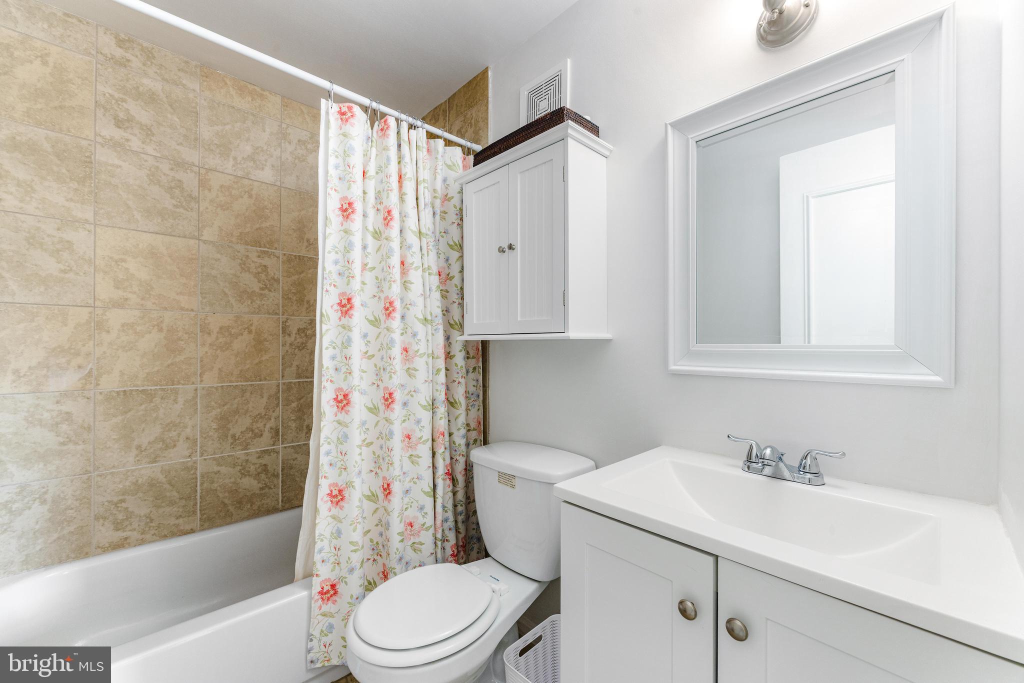 9023 Deviation Road Nottingham, MD 21236 - Photo 26 of 47 a bathroom with a sink toilet and shower