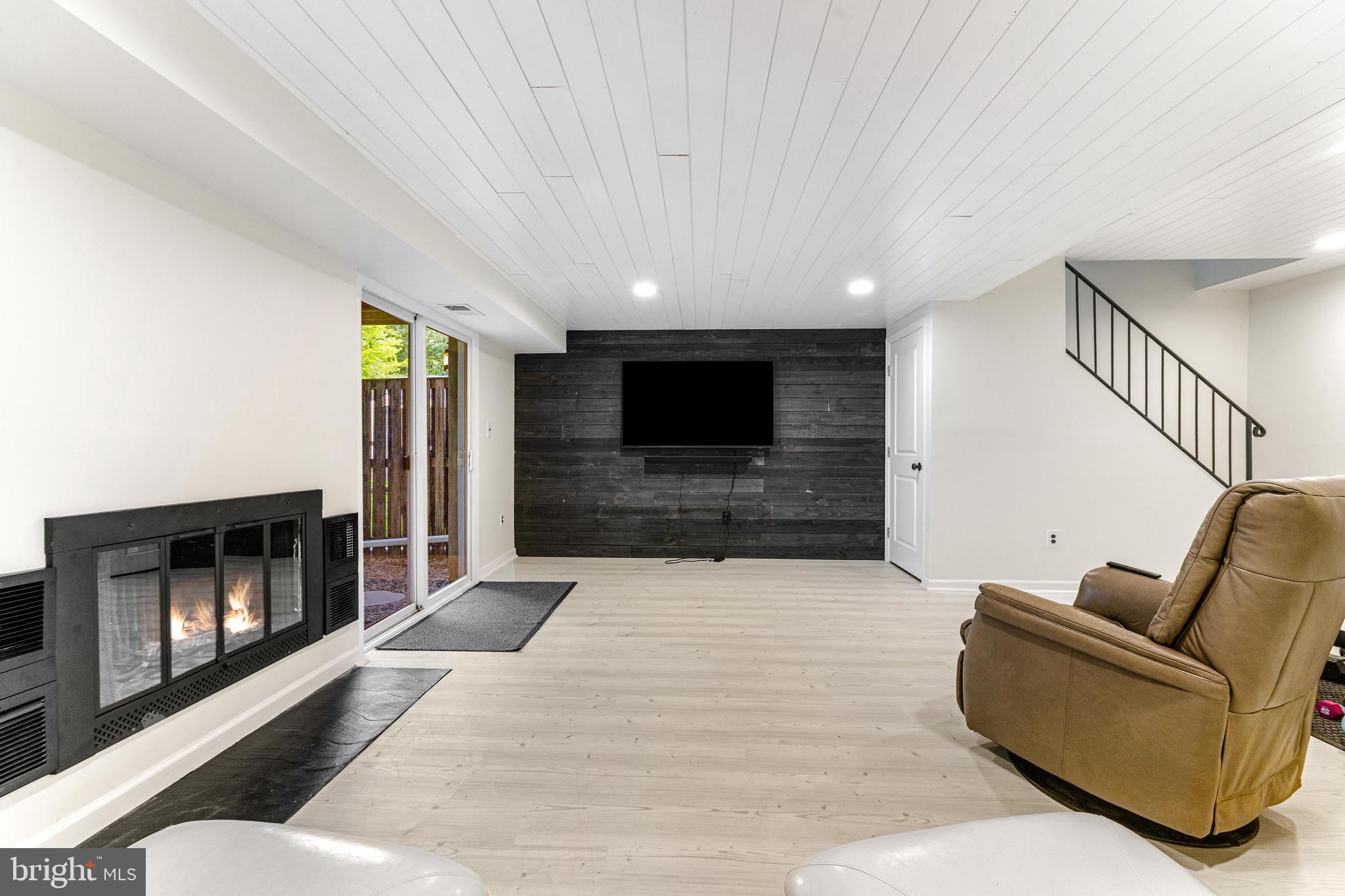 9023 Deviation Road Nottingham, MD 21236 - Photo 35 of 47 a living room with furniture and a fireplace
