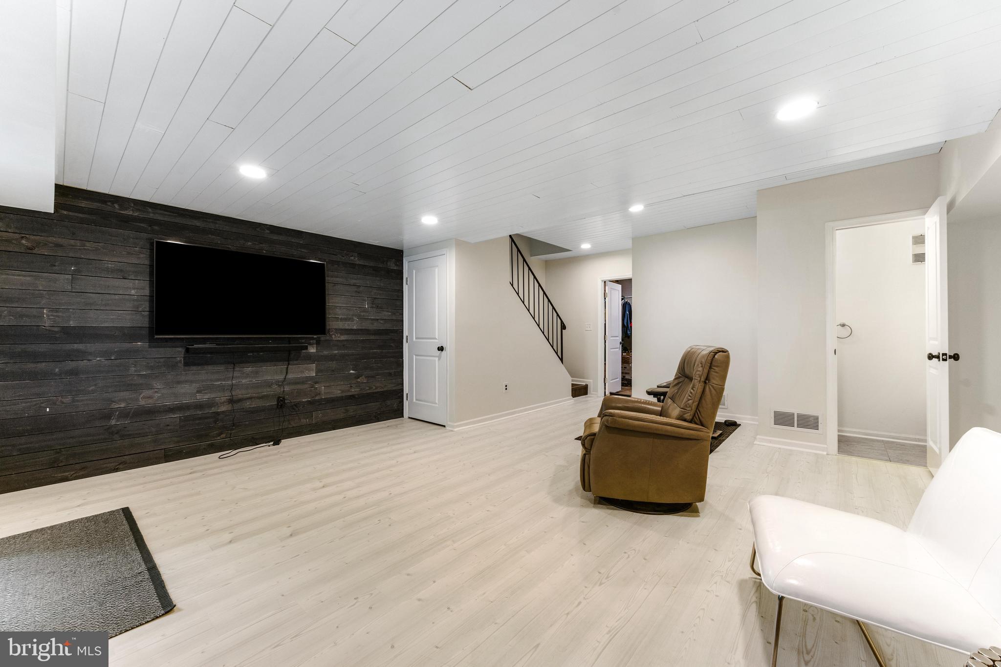 9023 Deviation Road Nottingham, MD 21236 - Photo 36 of 47 a living room with furniture and a flat screen tv