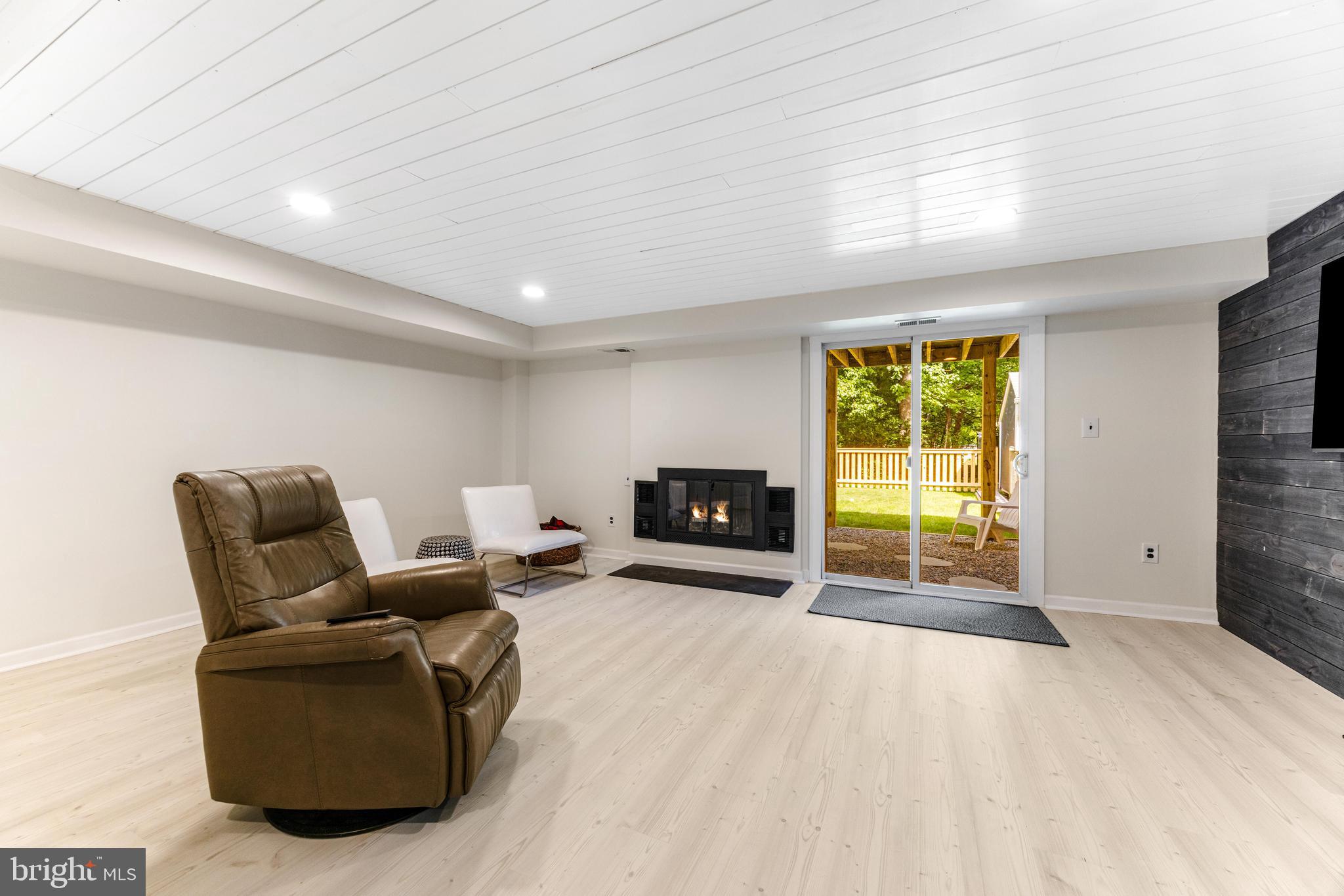 9023 Deviation Road Nottingham, MD 21236 - Photo 37 of 47 a living room with furniture and a fireplace