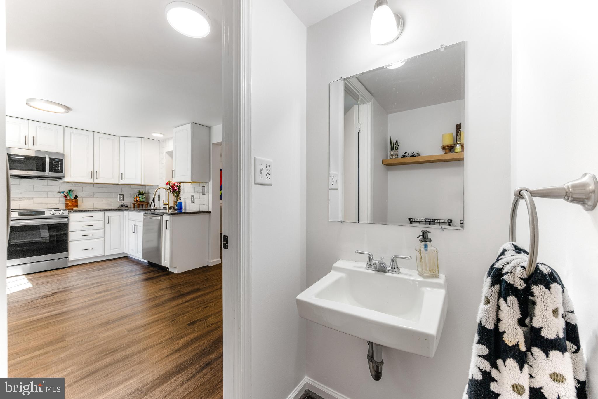 9023 Deviation Road Nottingham, MD 21236 - Photo 10 of 47 a kitchen with stainless steel appliances a sink and a refrigerator
