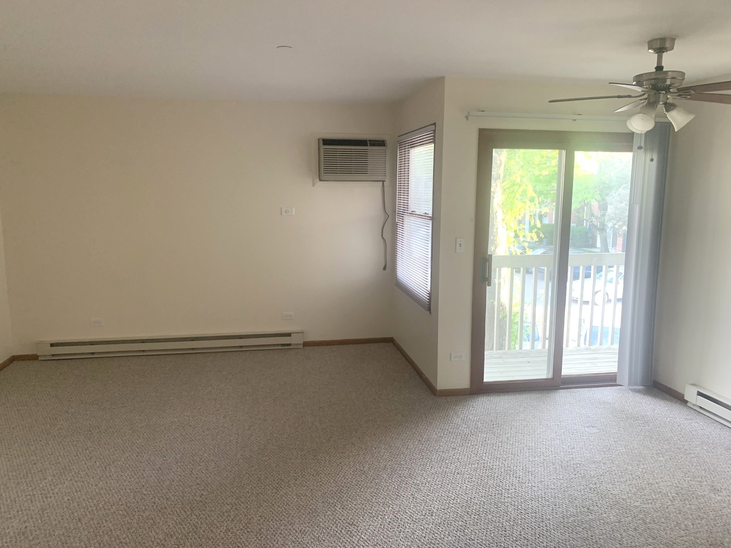 1352 Cunat Court, Unit 2C Lake In The Hills, IL 60156 - Photo 4 of 11 a view of an empty room with a window