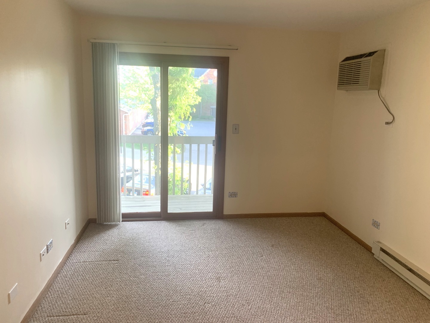 1352 Cunat Court, Unit 2C Lake In The Hills, IL 60156 - Photo 7 of 11 an empty room with windows