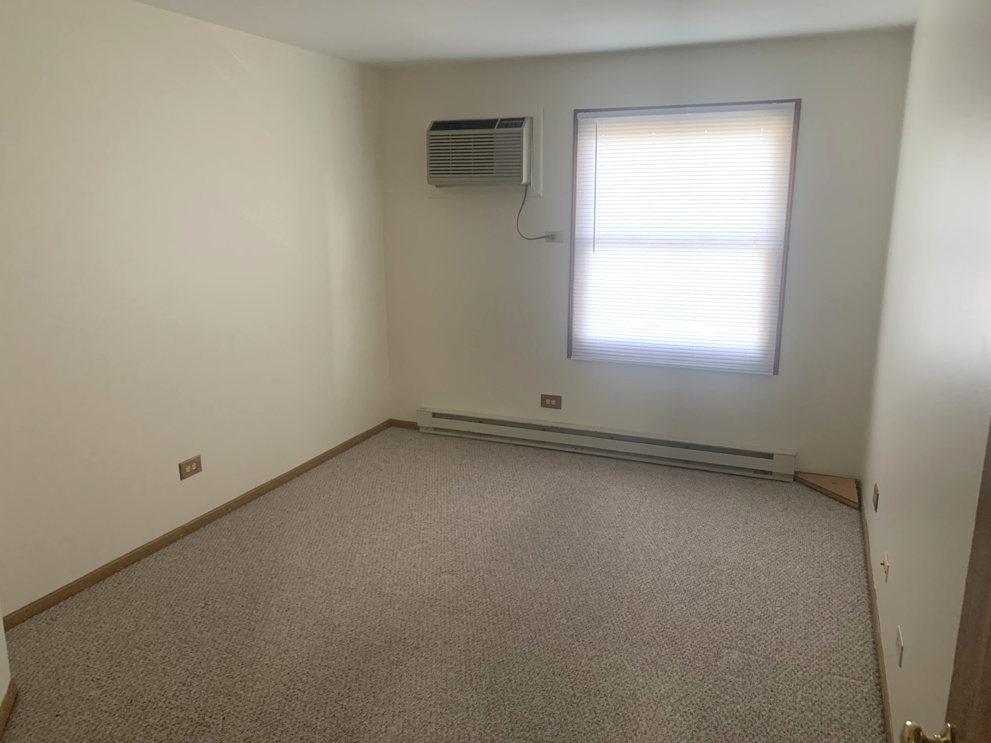 1352 Cunat Court, Unit 2C Lake In The Hills, IL 60156 - Photo 9 of 11 an empty room with a window