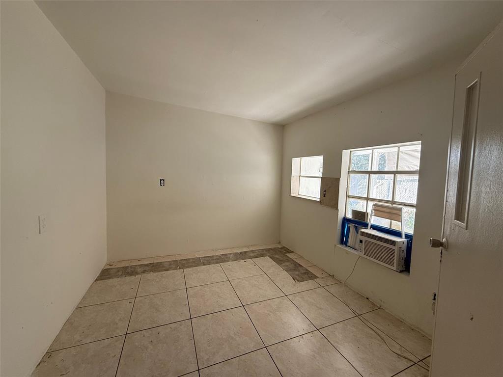 9013 Burr Drive Polk City, FL 33868 - Photo 13 of 20 a view of an empty room with a window