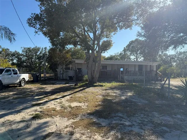 a view of a yard with a tree