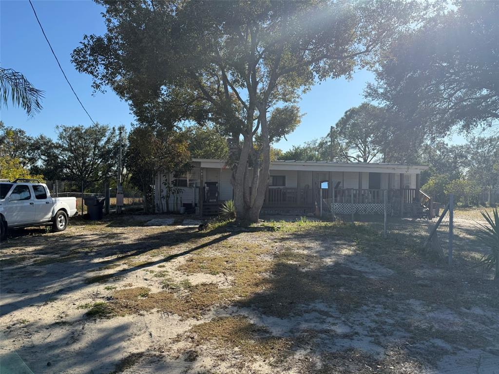 9013 Burr Drive Polk City, FL 33868 - Photo 2 of 20 a view of a yard with a tree