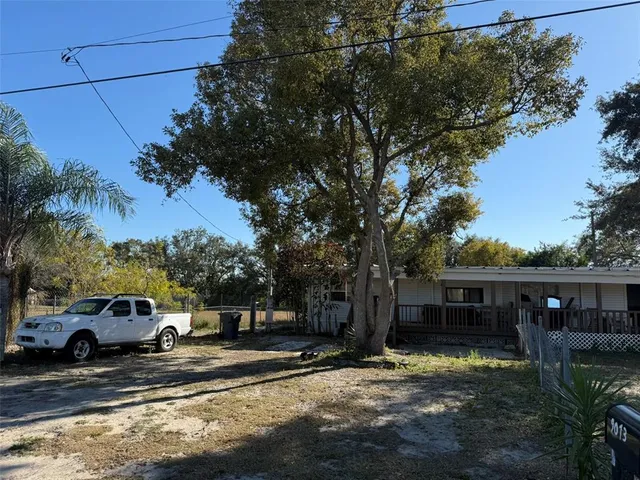 a view of a car park in front of a house