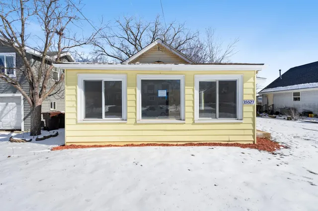 a view of a house with a iron gate