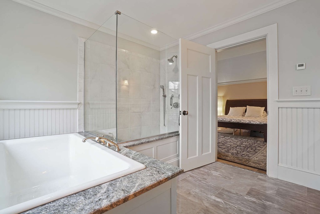 111 Tower Road Lincoln, MA 01773 - Photo 21 of 30 a bathroom with a tub and a shower