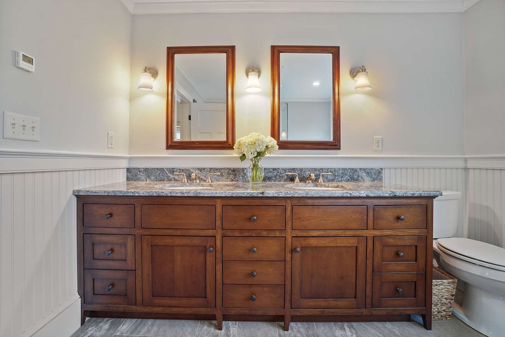 111 Tower Road Lincoln, MA 01773 - Photo 22 of 30 a bathroom with a granite countertop double vanity sink and mirror