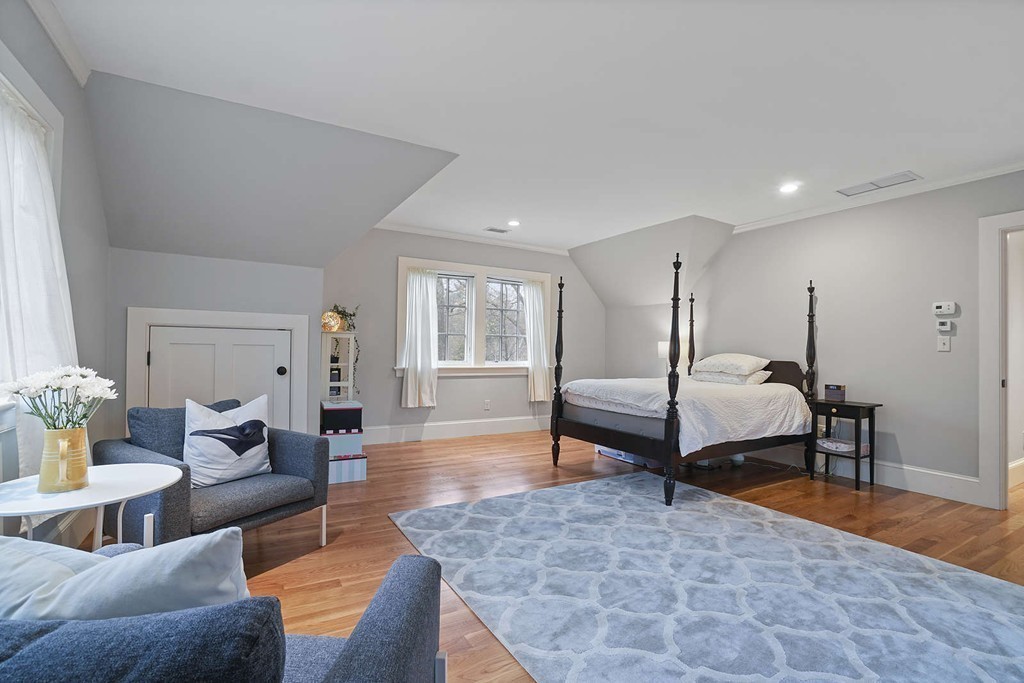 111 Tower Road Lincoln, MA 01773 - Photo 24 of 30 a bedroom with furniture and wooden floor