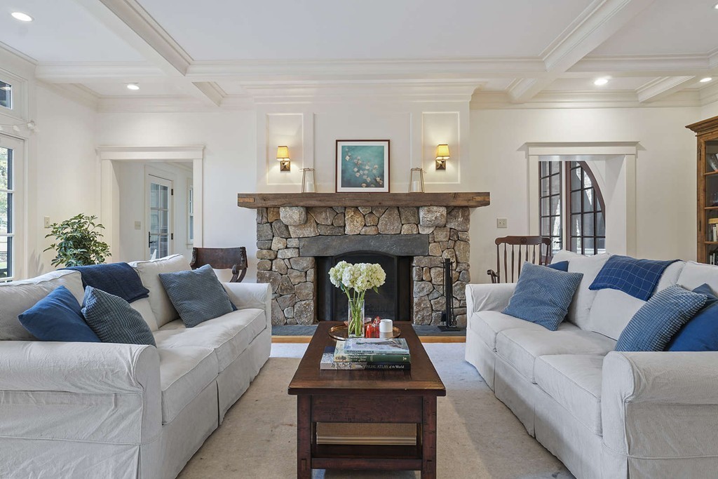 111 Tower Road Lincoln, MA 01773 - Photo 3 of 30 a living room with furniture and a fireplace
