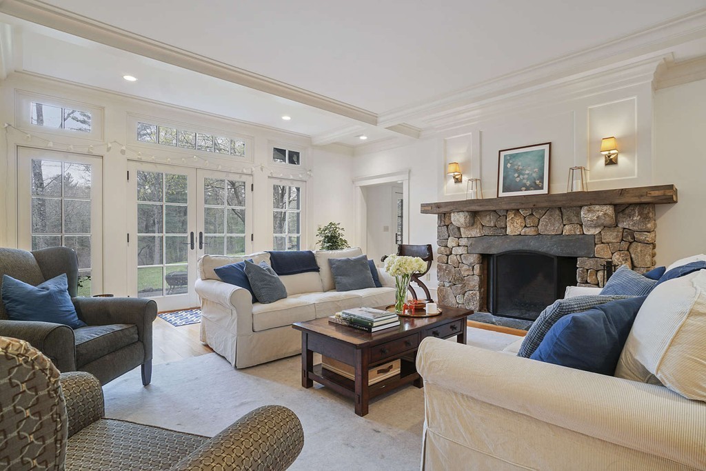 111 Tower Road Lincoln, MA 01773 - Photo 7 of 30 a living room with furniture and a fireplace