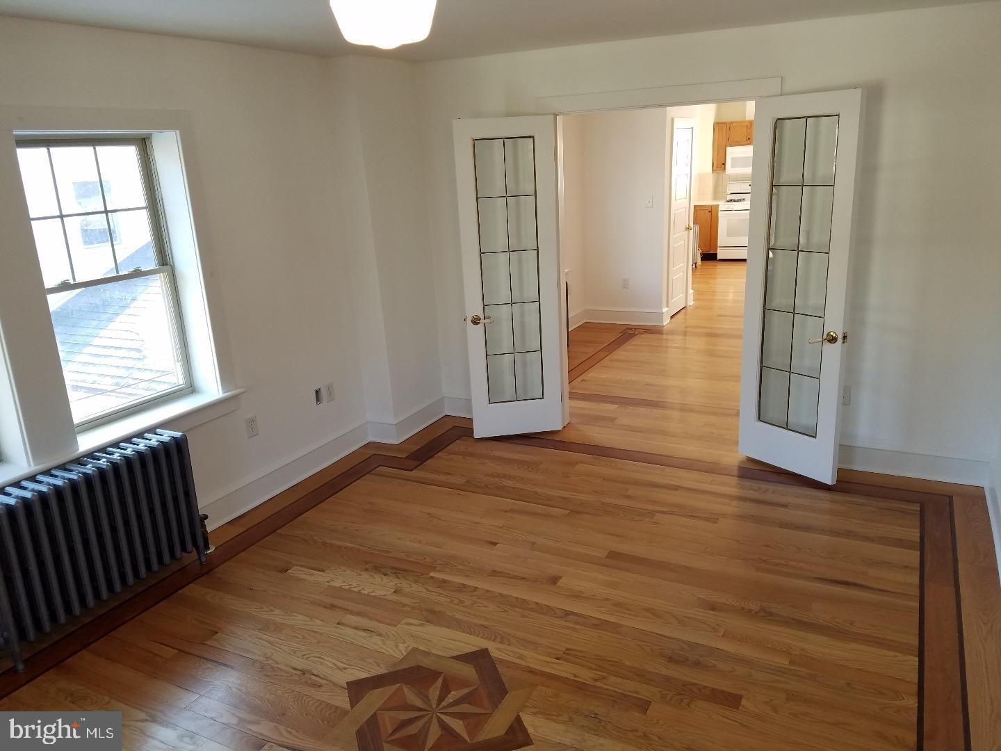 4087 Highway 202, Unit B Doylestown, PA 18902 - Photo 1 of 16 an empty room with wooden floor and windows