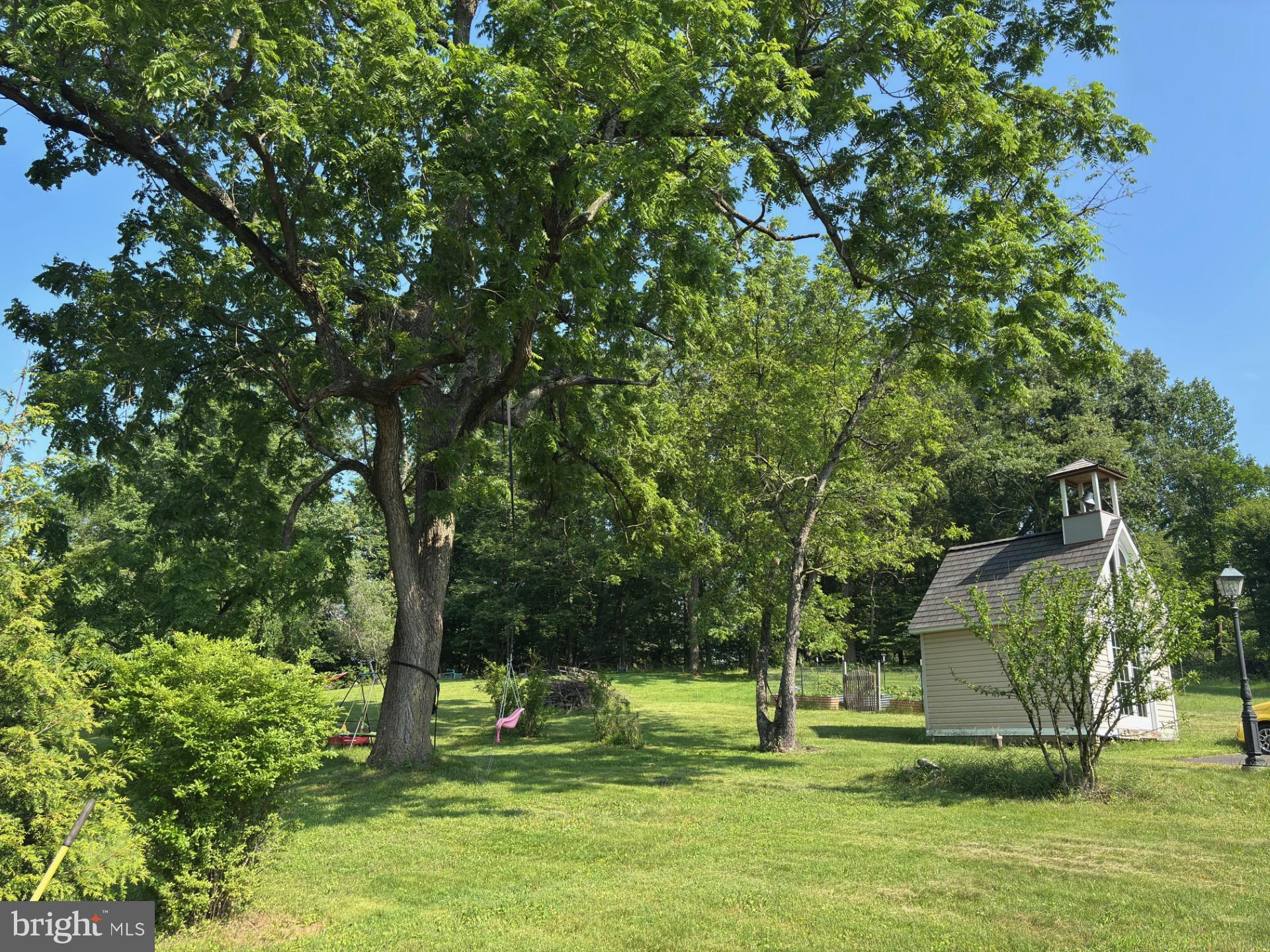 4087 Highway 202, Unit B Doylestown, PA 18902 - Photo 14 of 16 a garden with trees in the background