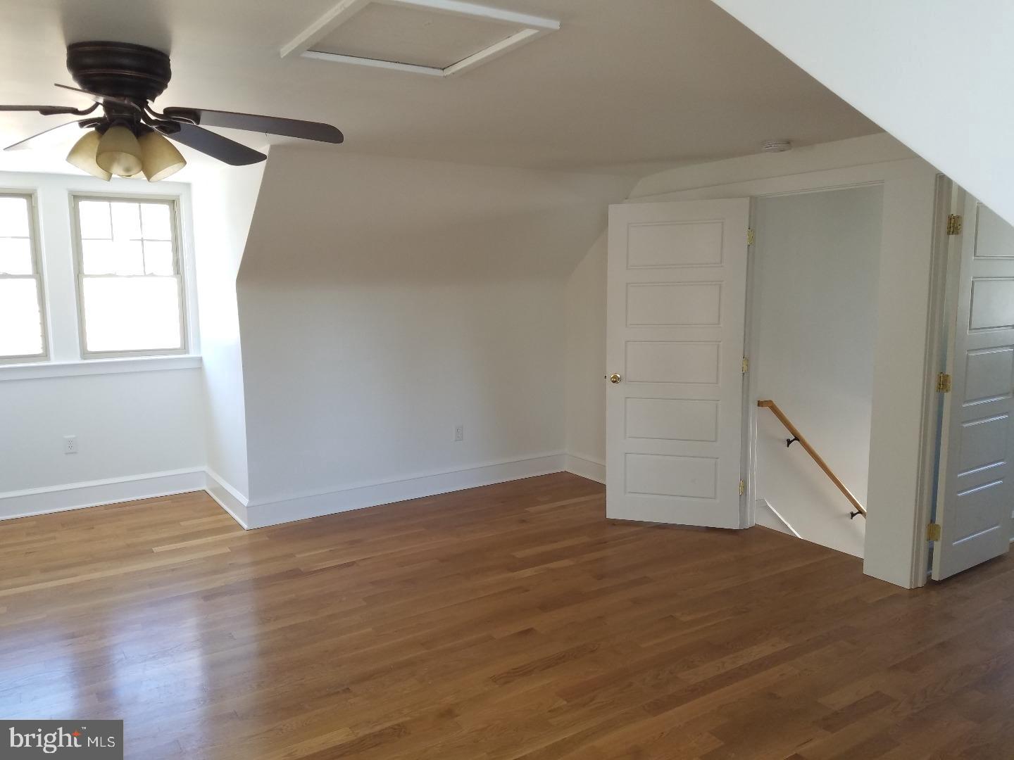 4087 Highway 202, Unit B Doylestown, PA 18902 - Photo 7 of 16 a view of empty room with wooden floor and fan