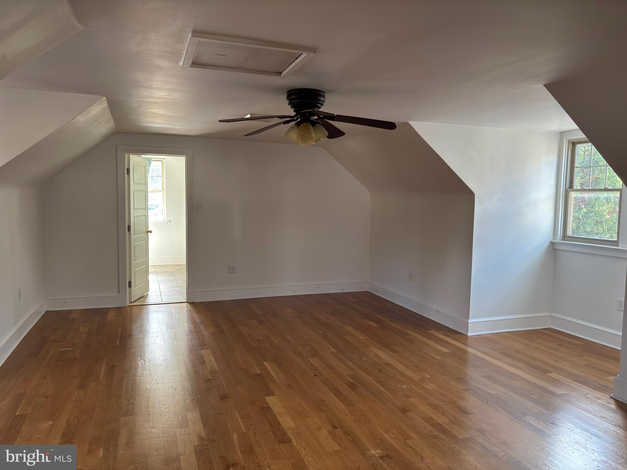 4087 Highway 202, Unit B Doylestown, PA 18902 - Photo 9 of 16 an empty room with wooden floor and windows