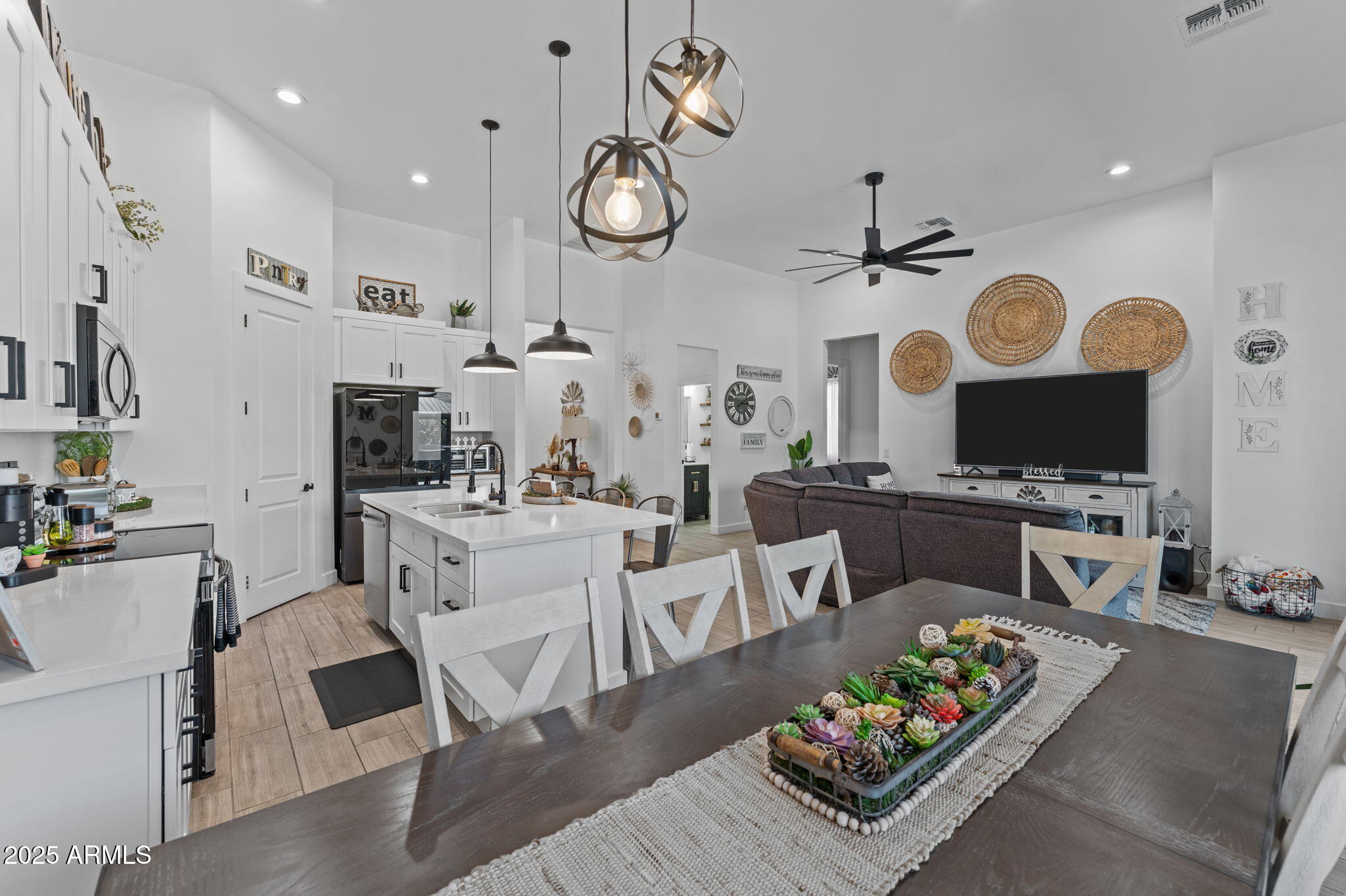 10534 East Butte Street Apache Junction, AZ 85120 - Photo 11 of 51 a living room with furniture kitchen view and a flat screen tv