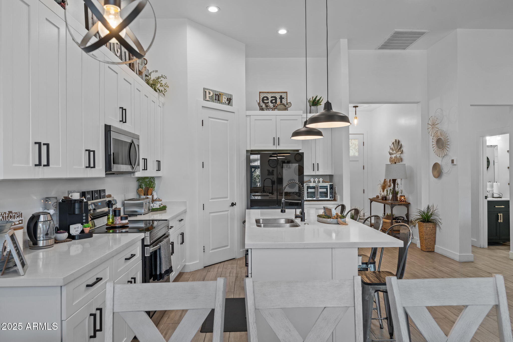 10534 East Butte Street Apache Junction, AZ 85120 - Photo 12 of 51 a kitchen with kitchen island a appliances dining table and chairs