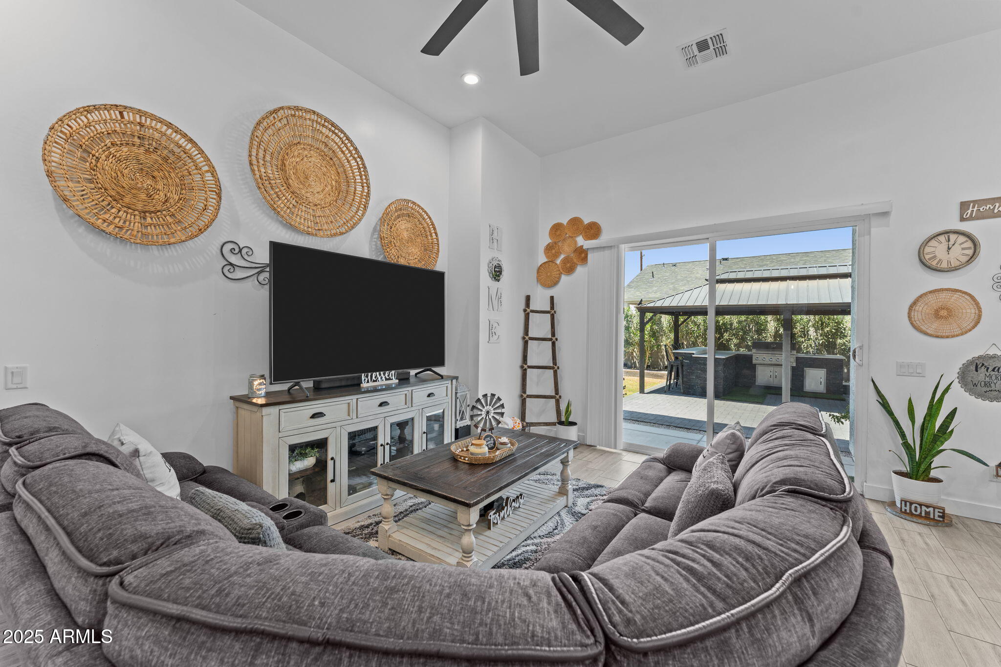 10534 East Butte Street Apache Junction, AZ 85120 - Photo 18 of 51 a living room with furniture a flat screen tv and a window