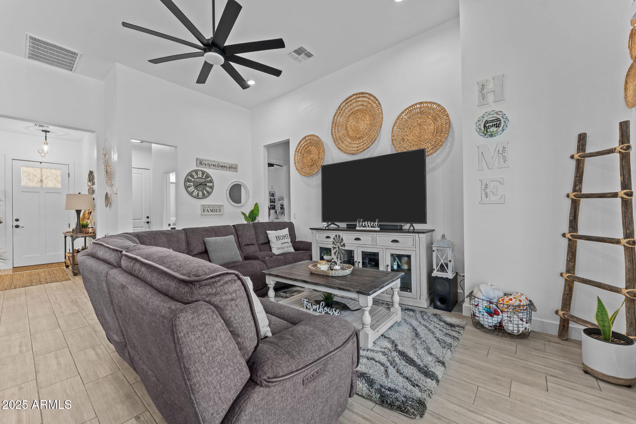 10534 East Butte Street Apache Junction, AZ 85120 - Photo 20 of 51 a living room with furniture and a flat screen tv