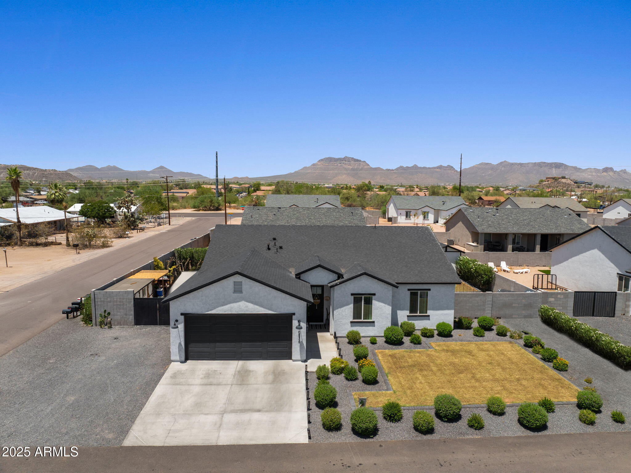 10534 East Butte Street Apache Junction, AZ 85120 - Photo 2 of 51 a front view of a house with a yard
