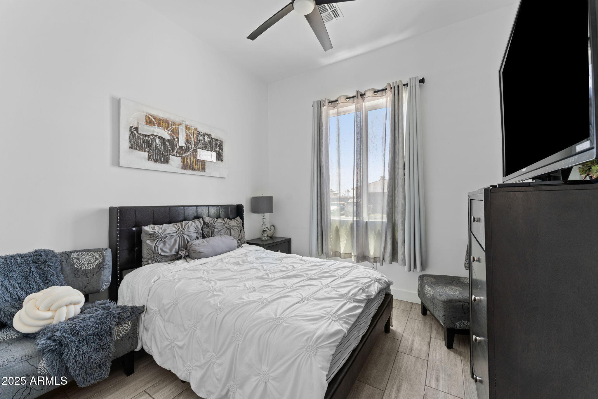 10534 East Butte Street Apache Junction, AZ 85120 - Photo 23 of 51 a bedroom with a bed and a window