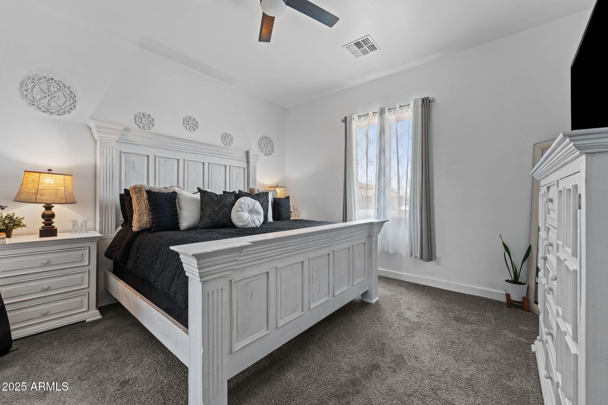 10534 East Butte Street Apache Junction, AZ 85120 - Photo 25 of 51 a bed room with a bed window and a television