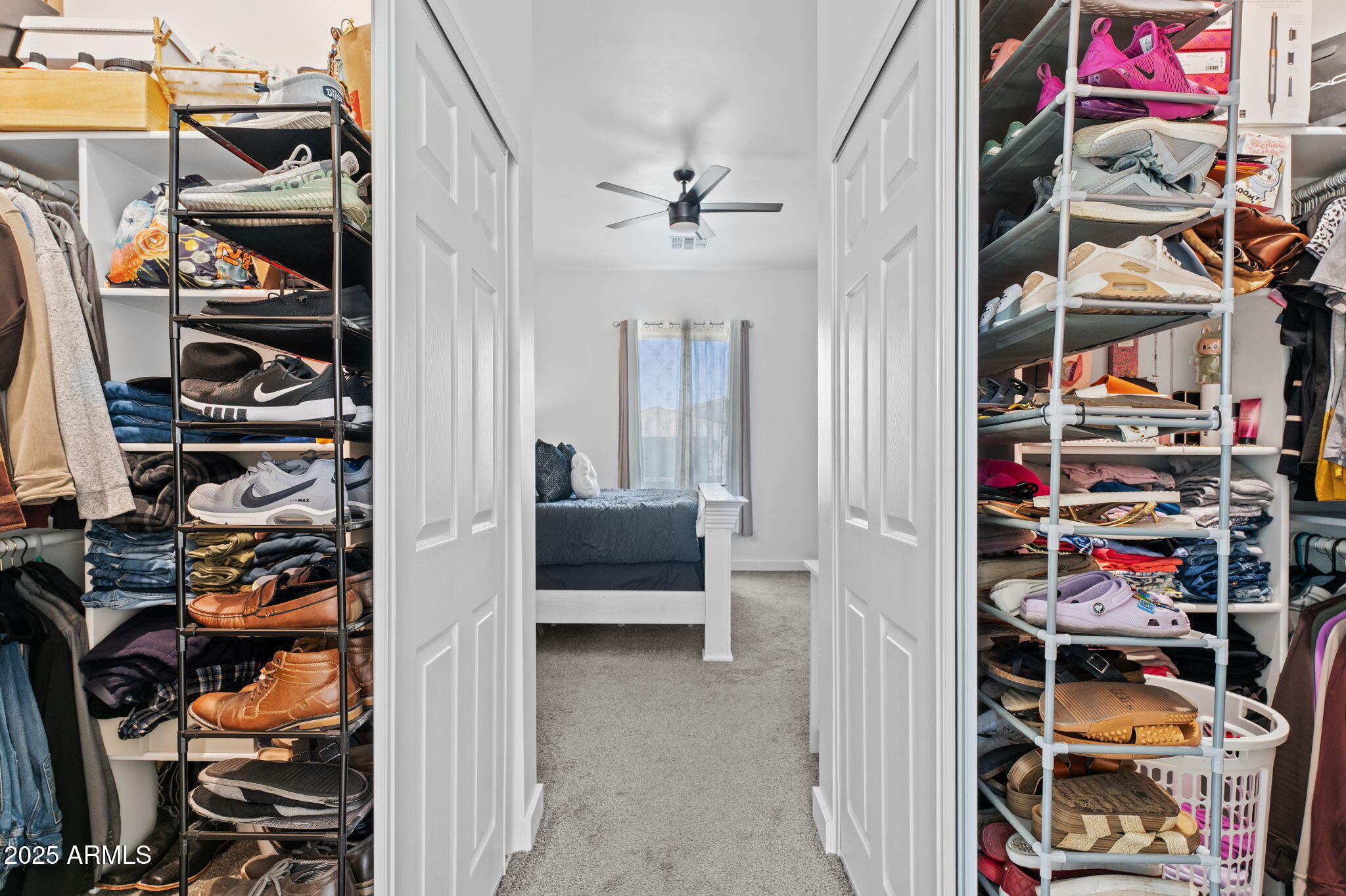 10534 East Butte Street Apache Junction, AZ 85120 - Photo 30 of 51 a view of walk in closet with clothes and shoes