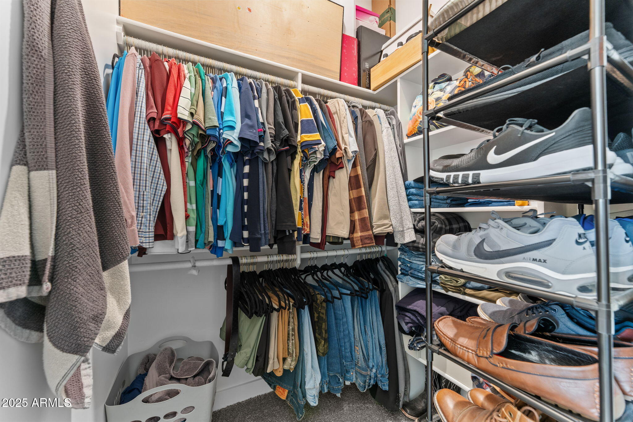 10534 East Butte Street Apache Junction, AZ 85120 - Photo 31 of 51 a view of walk in closet with clothes and shoes