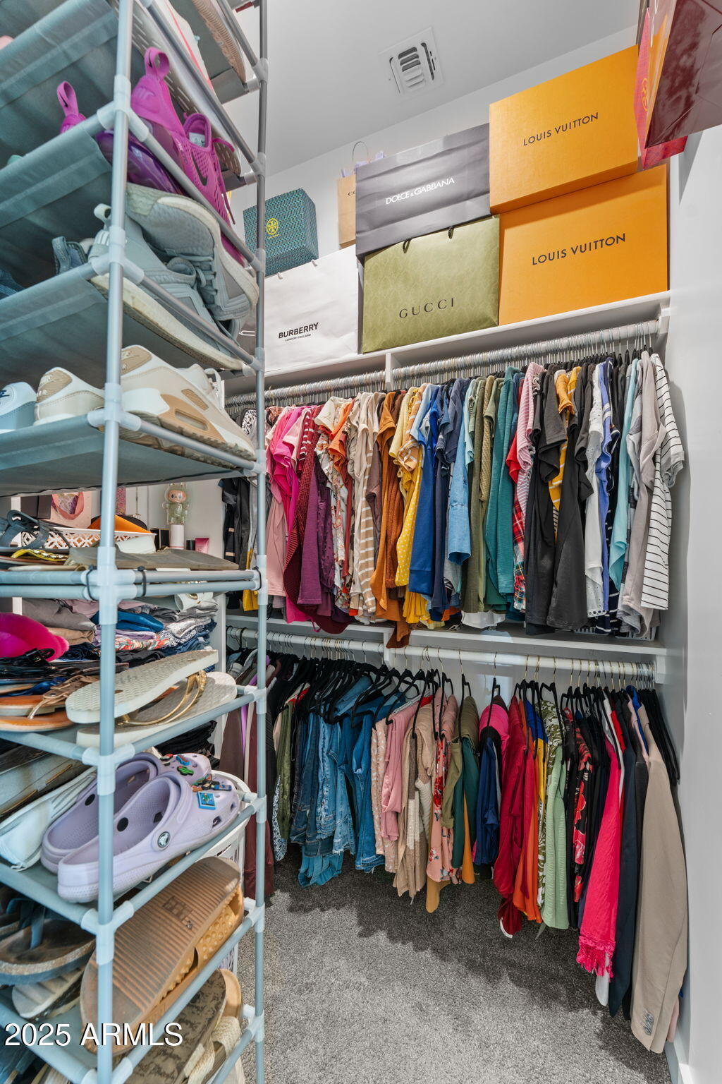 10534 East Butte Street Apache Junction, AZ 85120 - Photo 32 of 51 a view of walk in closet with clothes