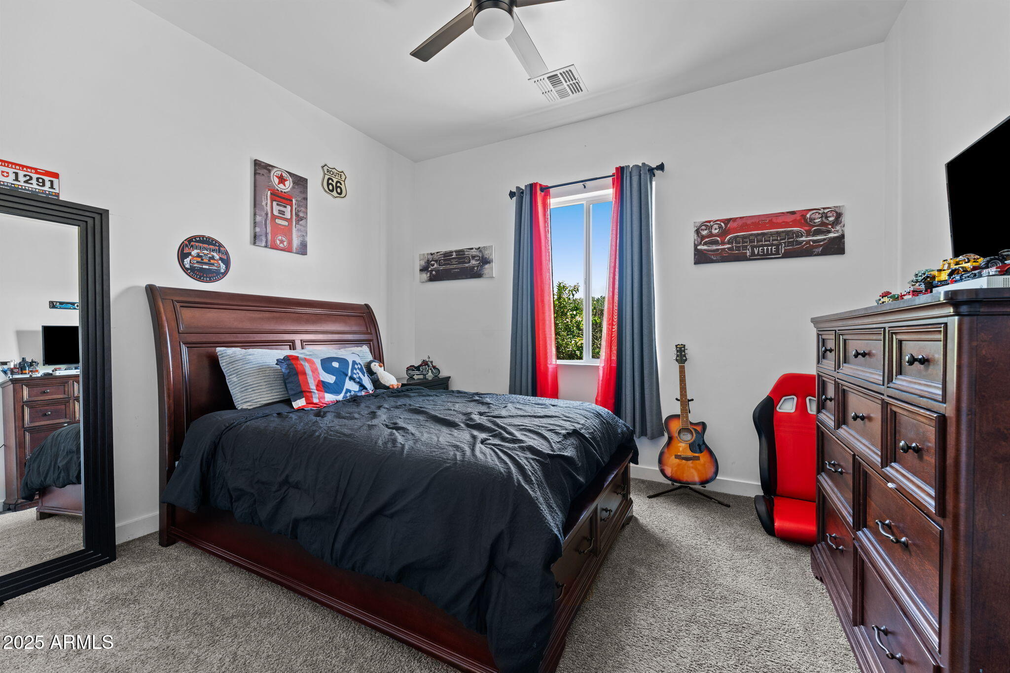 10534 East Butte Street Apache Junction, AZ 85120 - Photo 33 of 51 a bedroom with a bed and a tv in it